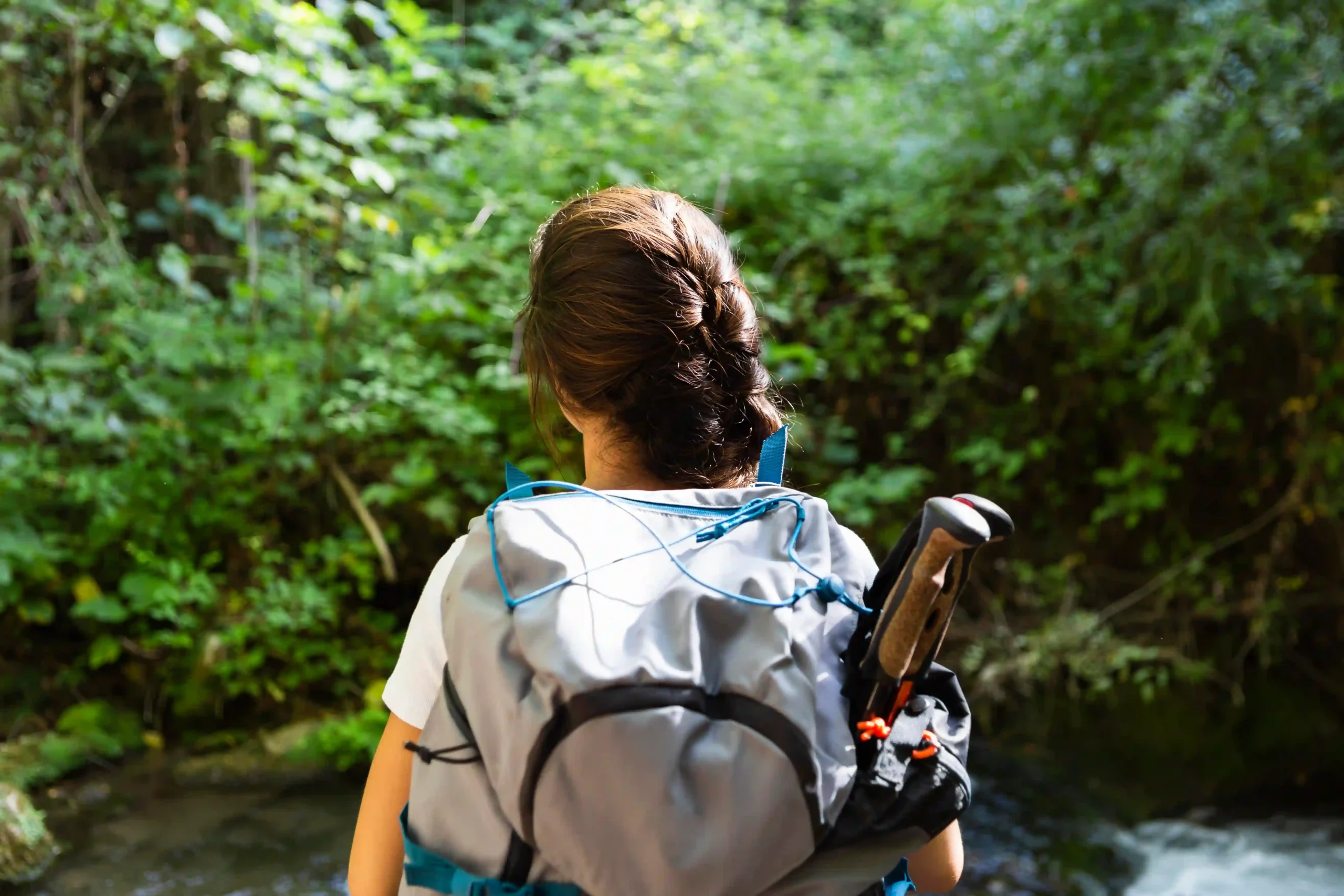 back-view-woman-with-backpack-exploring-nature